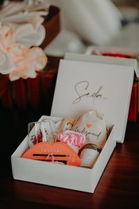 Close-up of a beautifully arranged bridesmaid gift box featuring personalized items and thoughtful details.